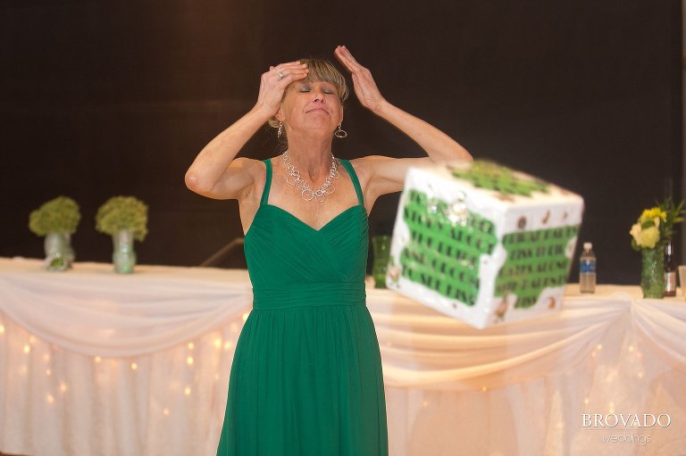 Bridesmaid rolling a giant dice