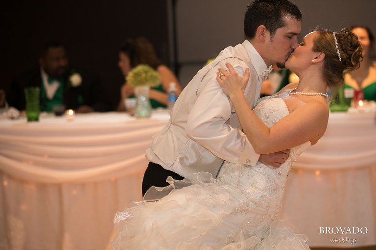 Groom dipping bride during first dance