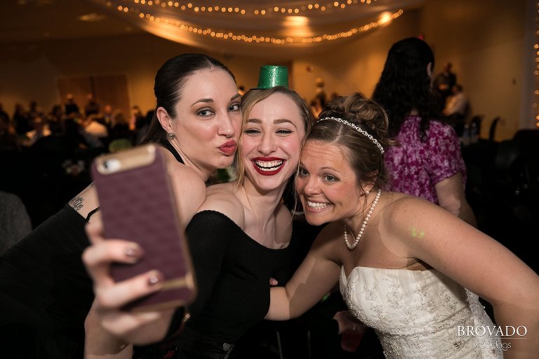 Wedding guests posing with the bride