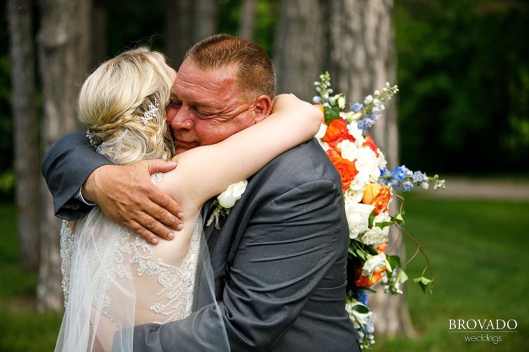 Bride and her father embracing