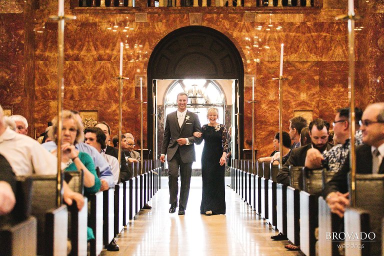 Aaron and his mother walking down the aisle