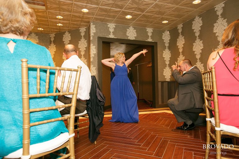 Bridesmaid posing in front of reception