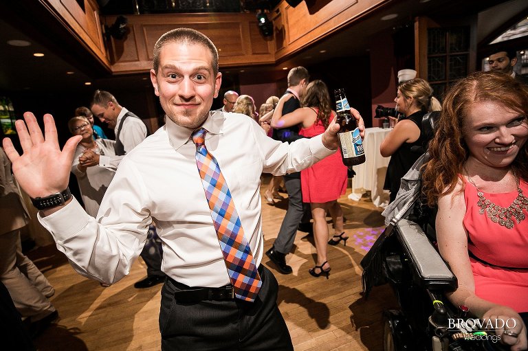 Wedding guest raising the roof on dance floor