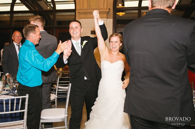 Annie and Tyler cheering during grand entrance