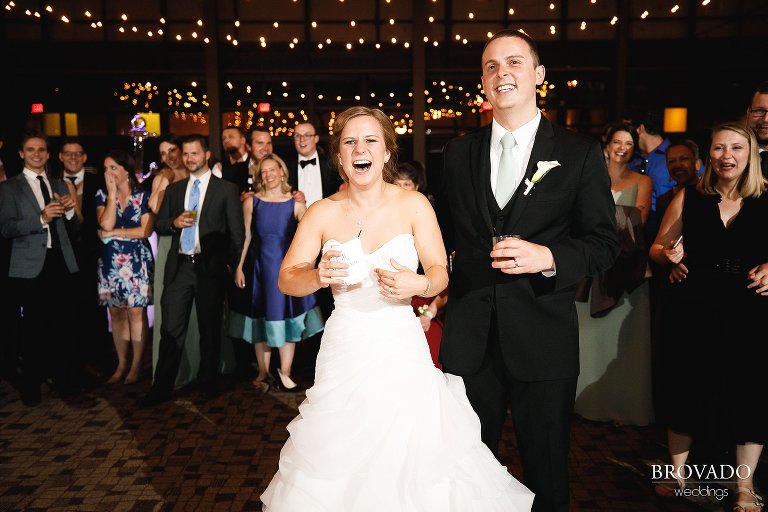 Bride and groom laughing during family reception