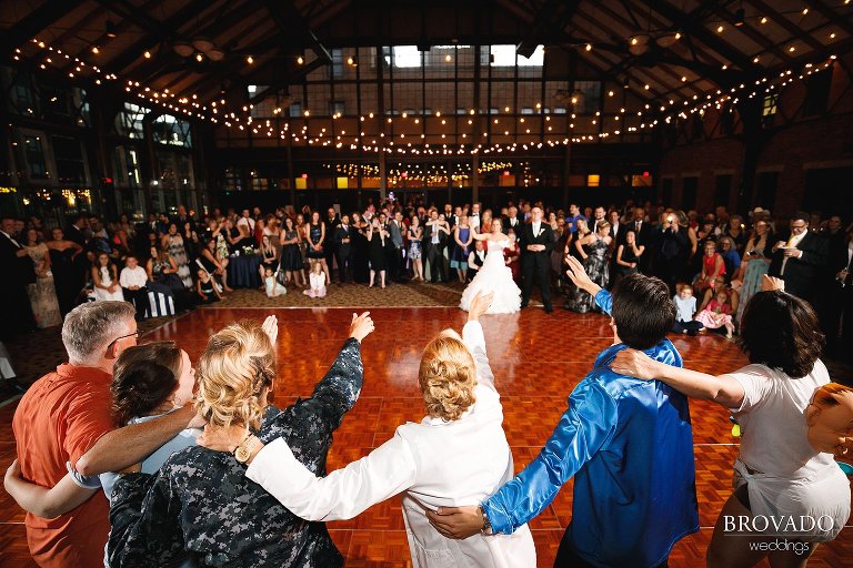 Bride and groom's family doing a goofy dance