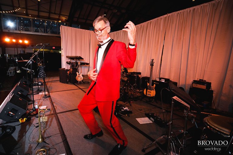 Wedding guest doing the air guitar