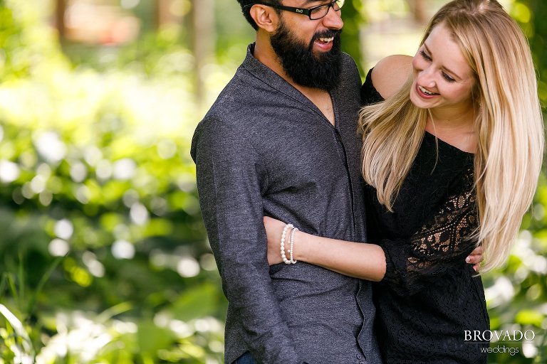 Engaged couple laughing together