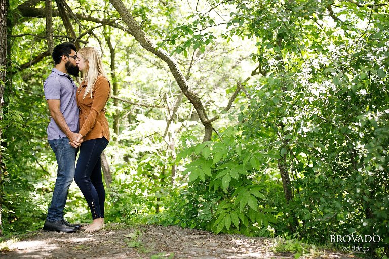 Bright kissing engagement pose