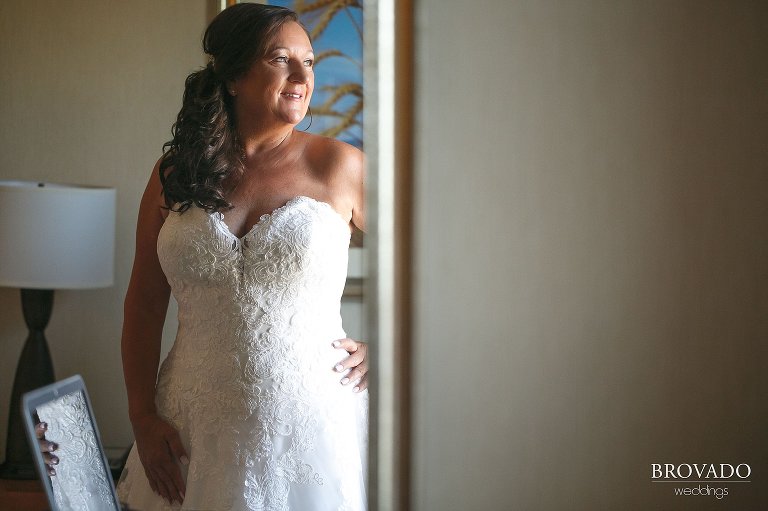 Sally smiling in front of a bright window