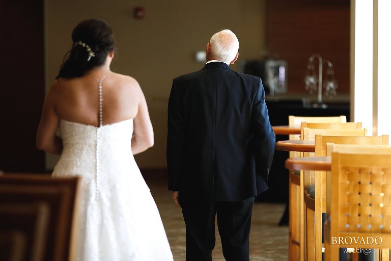 Sally walking up behind Daniel for first look
