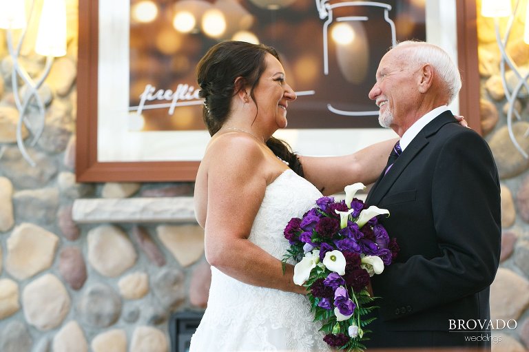 Bride and groom posing in hotel lobby