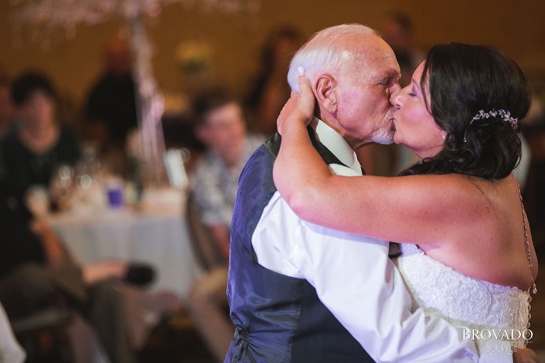 Bride and groom kissing during first dance