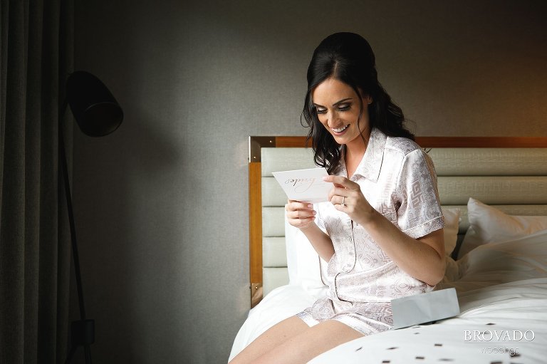 Laura reading a handwritten note from her fiance
