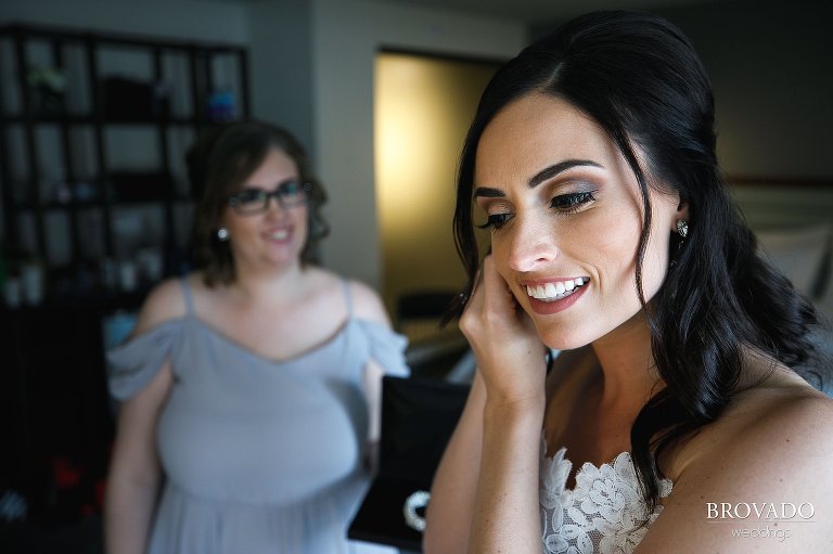 Laura putting on her earrings