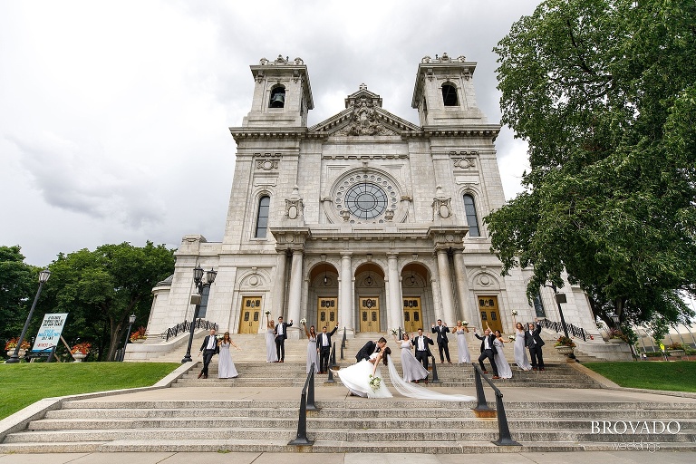 Wedding party posing on the steps of the Minneapolis basilica