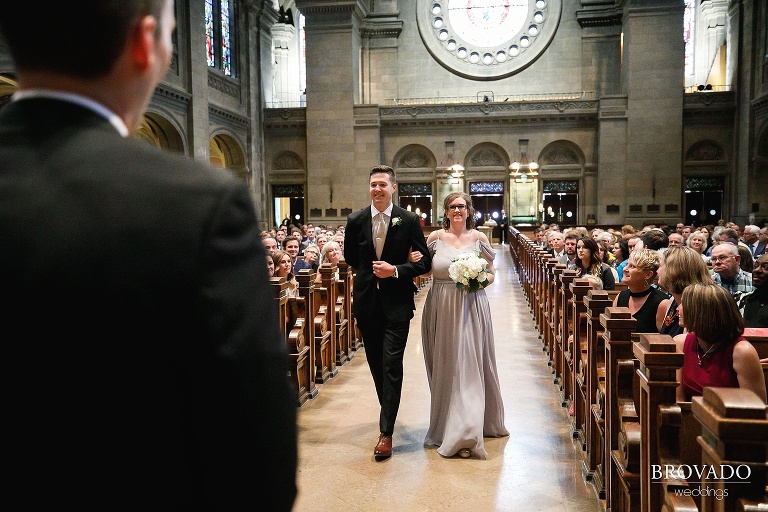 Maid of honor and best man walking down the aisle