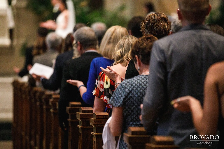 Guest praying during wedding ceremony