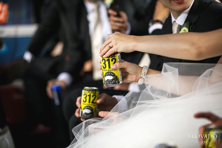 Bride enjoying a beer on the party bus