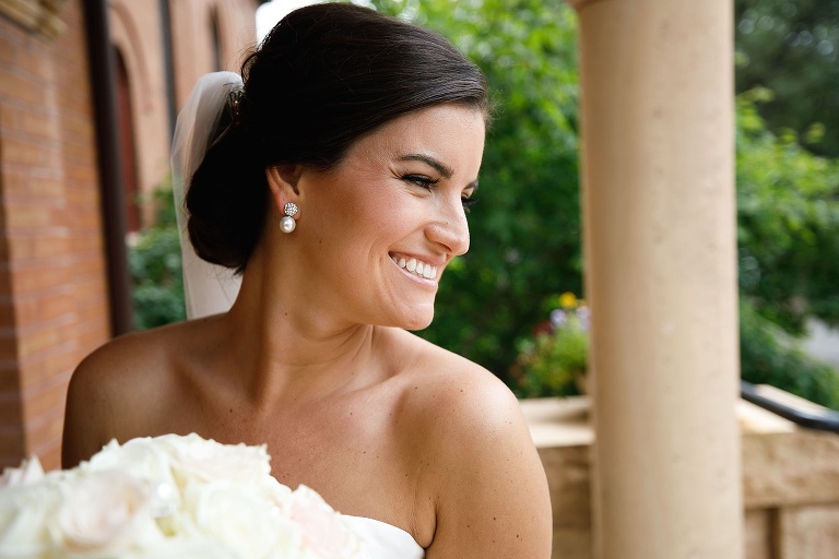 Julianne smiling over her shoulder on the church steps