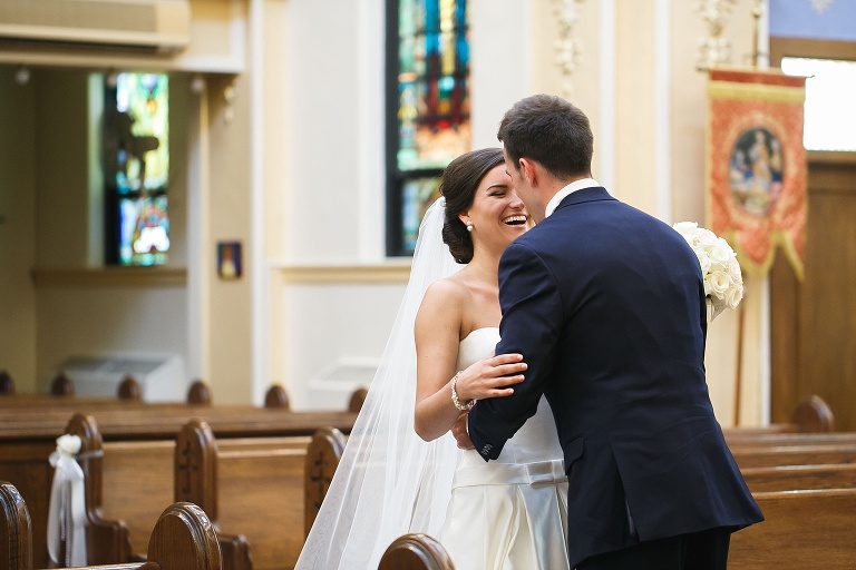 Julianne and Nick smiling and embracing