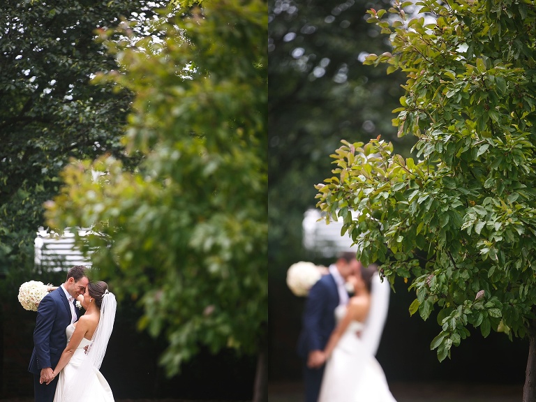 Julianne and Nick posing behind a tree