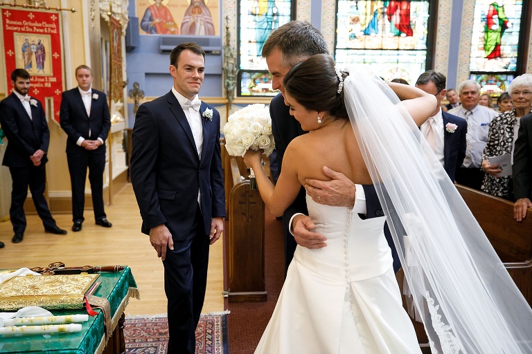 Bride's father giving her away