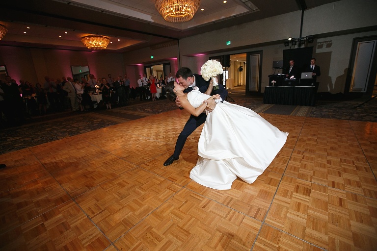 Nick dipping and kissing his bride