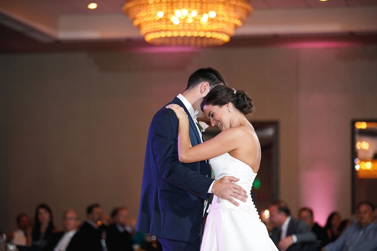 Newlyweds smiling during first dance