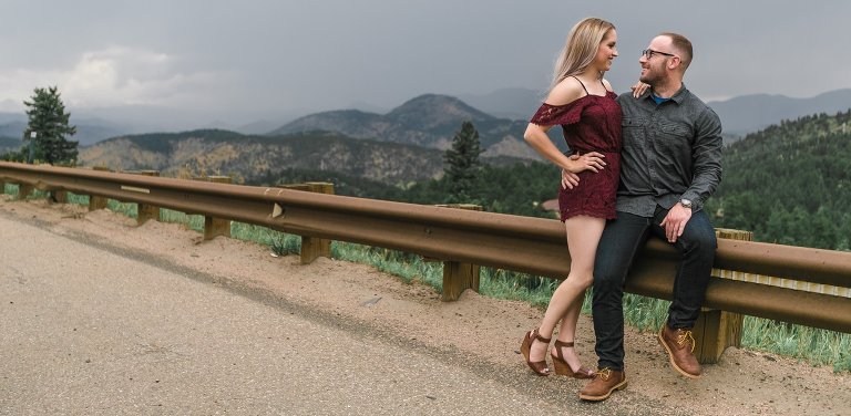 Wide angle of couple posing alongside country road