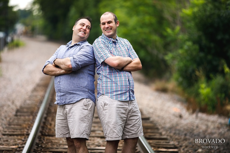 Candid same sex railroad engagement
