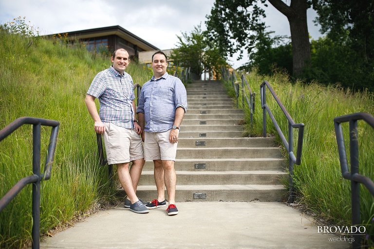 Tom and Zach posing in field in matching outfits
