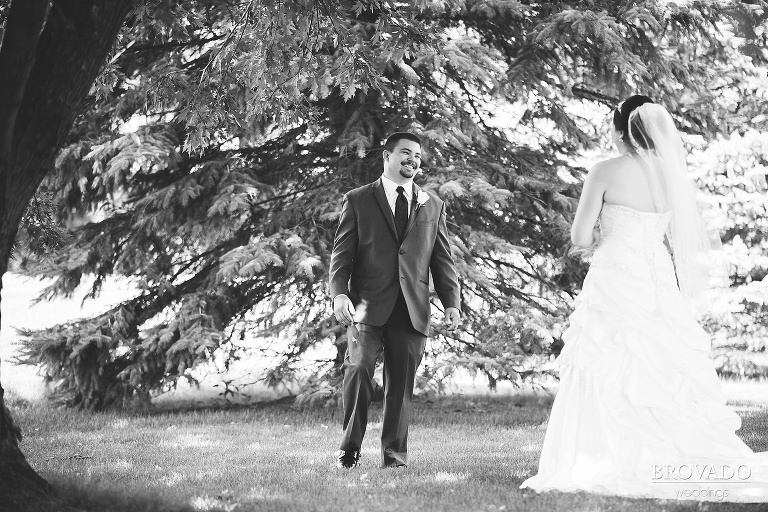 Groom smiling during first look