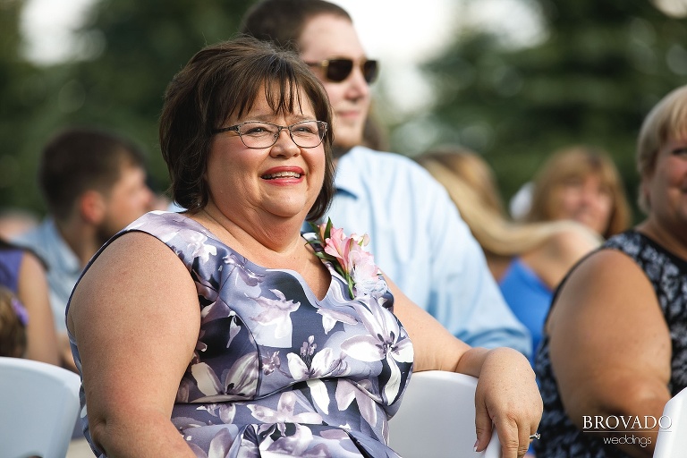 Mother of the bride smiling from the audience