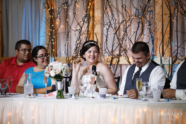 Elizabeth smiling during wedding toasts