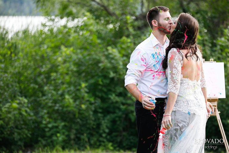 John and Nova kissing while covered in paint