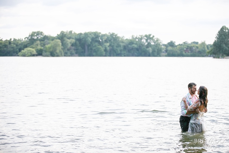 John and Nova kissing in knee deep water