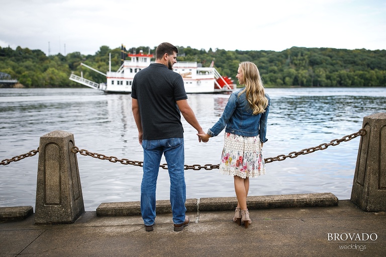 Natalie and Josh holding hands on the waterfront