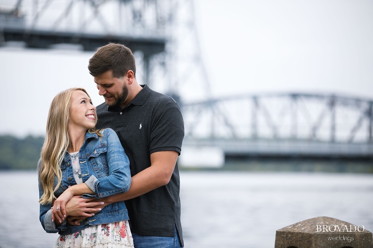 Natalie looking over her shoulder at Josh in front of stillwater lift bridge