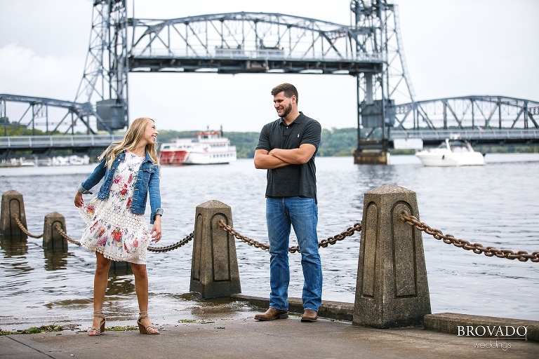Natalie and Josh dancing in front of stillwater lift bridge
