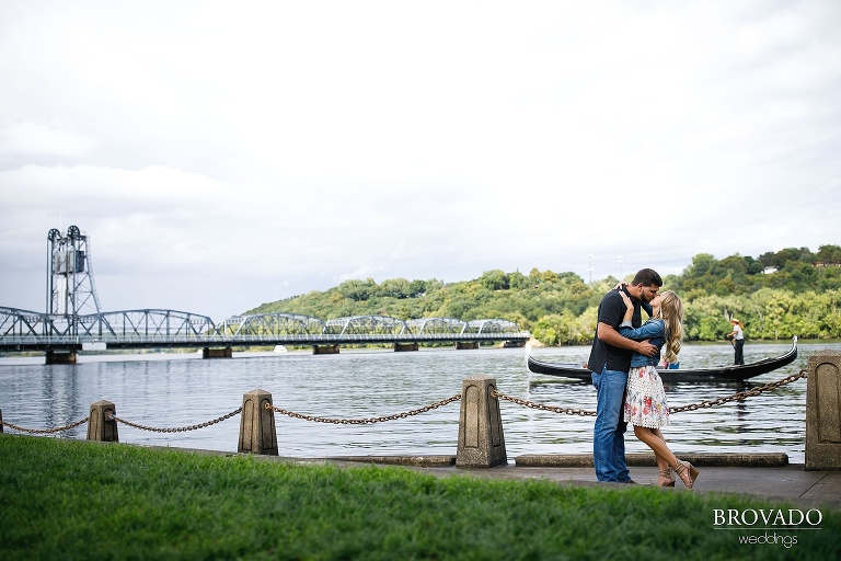 Couple kissing in front of gondola on the saint croix