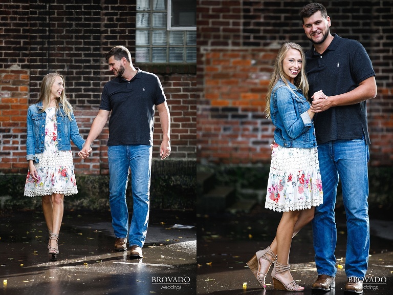Natalie and Josh posing in front of brick wall in Stillwater, MN