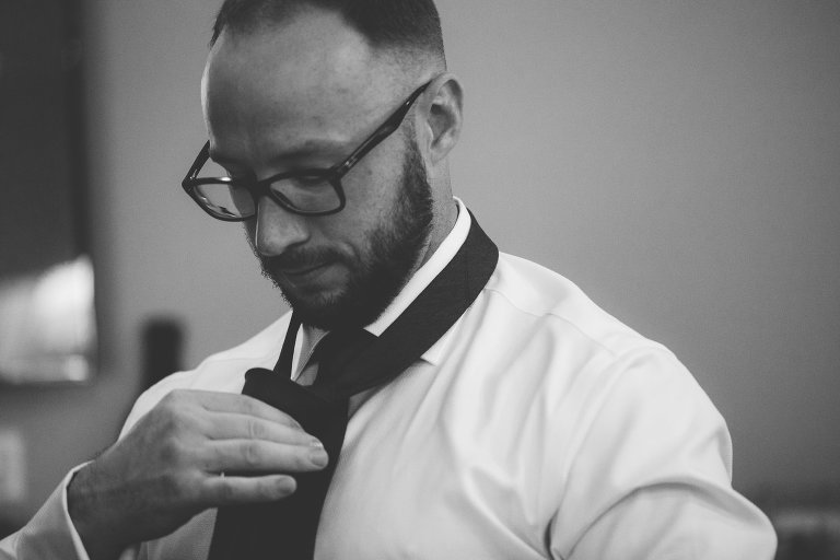 Zach putting on his tie