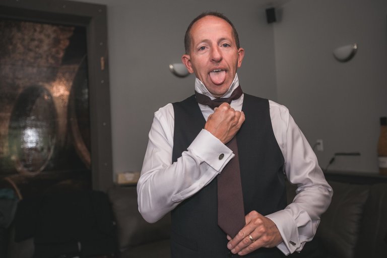 Groomsman getting dressed
