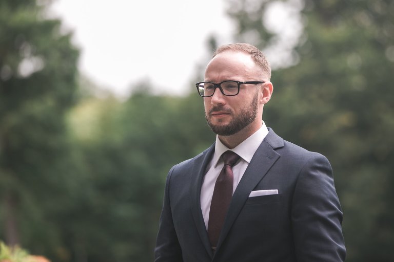 Dramatic portrait of groom Zach