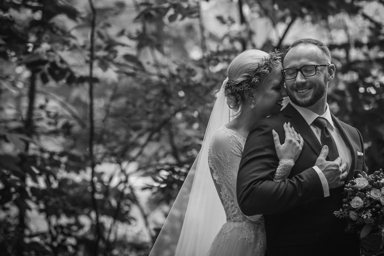 Sweet black and white portrait of bride and groom