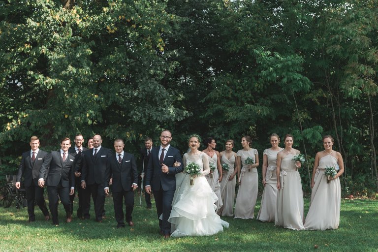 Wedding party walking towards the camera