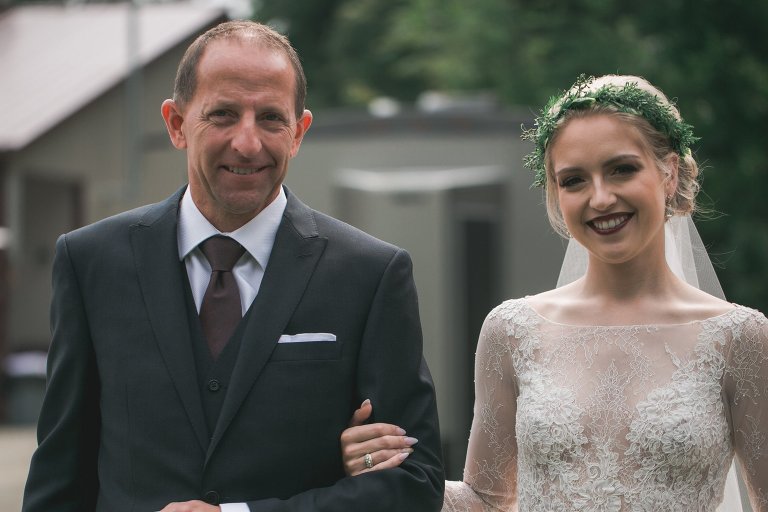 Coty and her father walking down the aisle