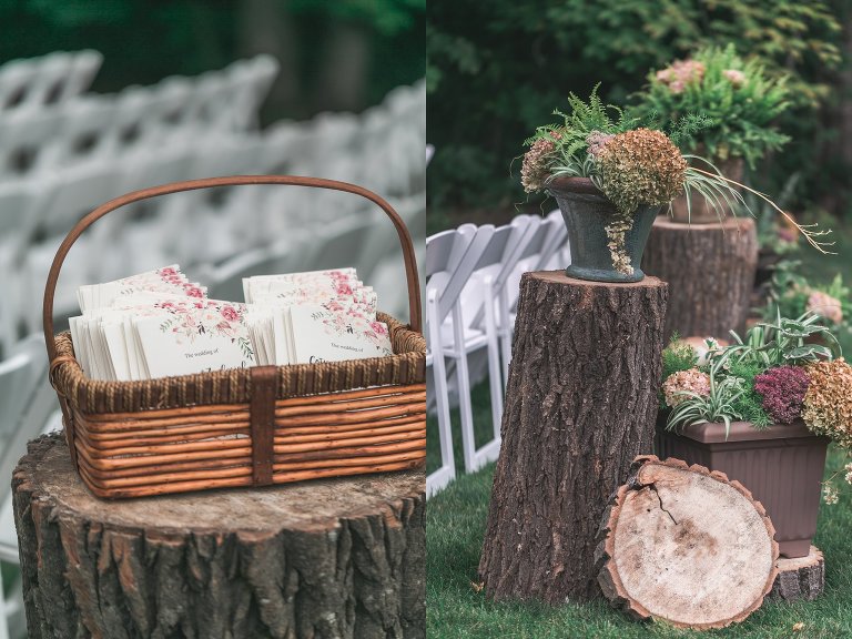 Detail of floral wedding programs and wood slices at outdoor farm wedding