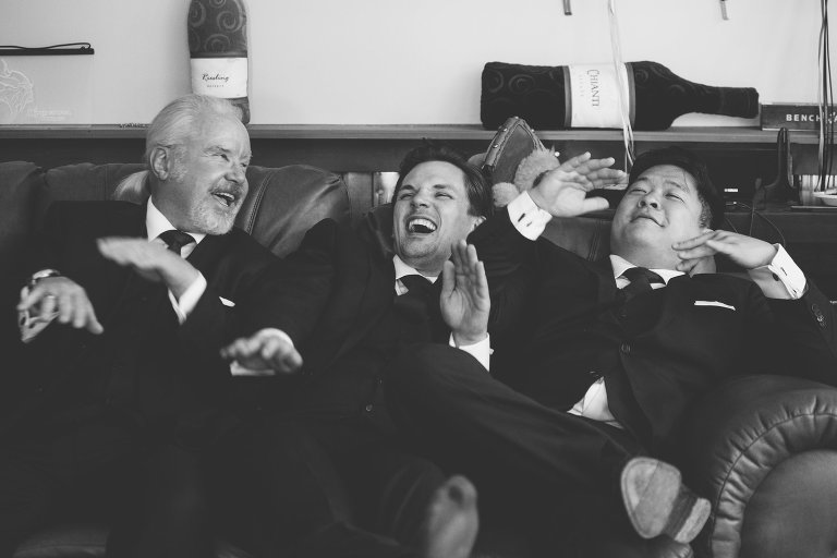 Candid of groomsmen laughing